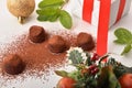 Christmas composition with chocolate truffles sprinkled with cocoa powder elevated Royalty Free Stock Photo