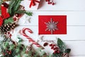 Christmas composition. Christmas gift, , pine cones, fir branches on wooden white background. Empty christmas card with envelope Royalty Free Stock Photo