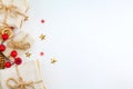 Christmas composition. Christmas gift, stars and mistletoe on white background. Flat lay, top view. Royalty Free Stock Photo