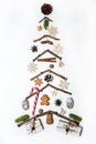 The Christmas tree is made of twigs and decorated with gingerbread, spices, caramel cane, gift boxes, cones and wooden toys on a w Royalty Free Stock Photo