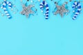 Christmas composition from Christmas tree toys. White decor on a blue background. Copy space, flat lay, top view. Royalty Free Stock Photo