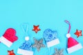 Christmas composition from Christmas tree toys. White decor on a blue background. Copy space, flat lay, top view. Royalty Free Stock Photo