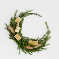 Christmas composition. Christmas wreath made of fir branches, balls, pine cones on white. Flat lay, top view, copy space Royalty Free Stock Photo