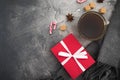 Christmas composition with coffee cup, candy, sugar and gift on gray background. Flat lay Royalty Free Stock Photo