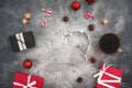 Christmas composition with coffee cup, candy, sugar and gifts on gray background. Flat lay Royalty Free Stock Photo