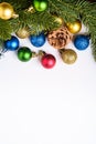 Christmas composition with copy space. Colorful ornament, baubles and fir needles decorations Royalty Free Stock Photo