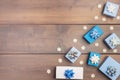 Christmas composition with copy space. In the corner are white and blue gift boxes decorated with bows, decorative Royalty Free Stock Photo