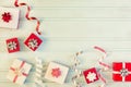 Christmas composition with copy space. Decorative ribbons, white and red gift boxes with beautiful bows. Royalty Free Stock Photo