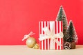 Christmas composition. craft Gift box, small tree, branches and craft DIY decorations on white background. New year Royalty Free Stock Photo