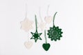 Christmas composition of crocheted white snowflakes and stars on white background. Top view, flat lay, copy space. Royalty Free Stock Photo