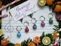 Christmas composition. Christmas decoration balls are arranged on the paper like music notes Royalty Free Stock Photo
