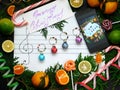 Christmas composition. Decoration balls are arranged on the paper like music notes. Christmas melody concept. Royalty Free Stock Photo