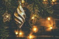 Christmas composition, decorations on the branches of a Christmas tree on a dark background with lights Royalty Free Stock Photo