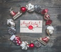 Christmas composition, Christmas decorations are lined up around the envelope on a wooden background, top view Royalty Free Stock Photo