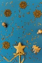 Christmas composition with decorative golden star, fir tree, balls and  snowflakes on blue background with sequins Royalty Free Stock Photo