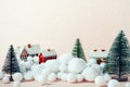 Christmas composition, decorative houses in the winter among the trees in snow