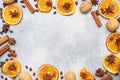 Christmas composition with dried oranges, cinnamon, anise and nuts on a gray concrete background. Flat lay top view. Copy space Royalty Free Stock Photo