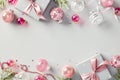 Christmas composition with elegant silver and pink elements. Festive flat lay design featuring glitter baubles, gift boxes with Royalty Free Stock Photo