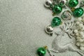 Christmas composition with ellk and Green Christmas balls with space copy on Silver glitter background Royalty Free Stock Photo