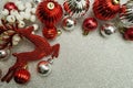 Christmas composition with ellk and Red Christmas balls with space copy on Silver glitter background Royalty Free Stock Photo