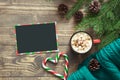 Christmas composition. Empty blank for wishing to Santa and cup of coffee on the board. Top view with copy space. Royalty Free Stock Photo