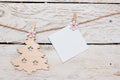 Christmas composition. Empty paper for writing down your desires on a light wooden table. Flat lay, top view