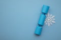 Christmas composition. Festive cracker with white winter snowflake