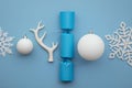 Christmas composition. Festive cracker with winter snowflake, antler and balls