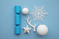 Christmas composition. Festive cracker with winter snowflake, antler and balls