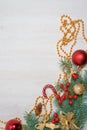 Christmas composition with fir tree branches and festive decoration on gray background Royalty Free Stock Photo