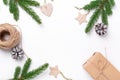 Christmas composition with fir tree branches, gift box and natural decor on white background Royalty Free Stock Photo