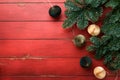 Christmas composition Christmas fir tree branches with pine cones papers rustic balls on wooden red rustic background Christmas Royalty Free Stock Photo