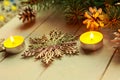 Christmas composition - flat lay photo with christmas tree branches and candles on wooden background. Royalty Free Stock Photo