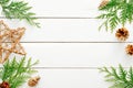 Christmas composition. Frame made of Christmas decorations and fir tree branch on wooden white table. Flat lay, top view, copy Royalty Free Stock Photo