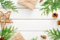 Christmas composition. Frame made of Christmas decorations and fir tree branch on wooden white table. Flat lay, top view, copy Royalty Free Stock Photo