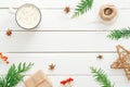 Christmas composition. Frame made of fir tree branches, Xmas decorations, cup of hot chocolate with marshmallow, red berry on Royalty Free Stock Photo