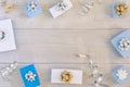 Christmas composition, frame. Small white and blue gift boxes, ribbons and bows. In the center there is a place for text Royalty Free Stock Photo
