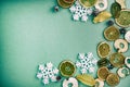 Christmas composition. Fruits, Snowflakes, Fir Cones on green background. Fruit and holiday pattern. Flat lay, top view, copy