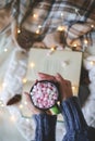 Christmas composition. garland book and marshmallow mug. Flat la