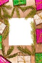 Christmas composition with gift boxes, fir branches and empty sheet of paper on wooden board, vertical Royalty Free Stock Photo