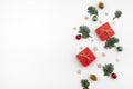 Christmas composition. Christmas gift, branches on white background. Flat lay, top view, copy space