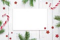 Christmas composition. Christmas gift, candy cane and fir tree branches. Top view, flat lay. Royalty Free Stock Photo