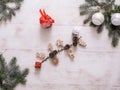 Christmas composition. Christmas gift, pine cones, fir branches on a wooden white background. Royalty Free Stock Photo