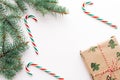 Christmas composition. Gifts, fir branches, red and green Christmas candies, decorations on a white background. The concept of Royalty Free Stock Photo