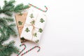 Christmas composition. Gifts, fir branches, red and green Christmas candies, decorations on a white background. The concept of Royalty Free Stock Photo