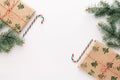 Christmas composition. Gifts, fir branches, red and green Christmas candies, decorations on a white background. The concept of Royalty Free Stock Photo