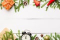 Christmas composition. Christmas gifts, pine branches, toys, vintage clock, anise stars, santa hat on wooden white background with Royalty Free Stock Photo