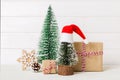 Christmas composition. Gifts, small tree, branches and craft DIY decorations on white background. New year concept Royalty Free Stock Photo