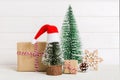 Christmas composition. Gifts, small tree, branches and craft DIY decorations on white background. New year concept Royalty Free Stock Photo