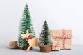 Christmas composition. Gifts, small tree, branches and craft DIY decorations on white background. New year concept Royalty Free Stock Photo